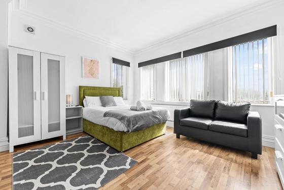Studio 3, double bed, sofa and wide windows